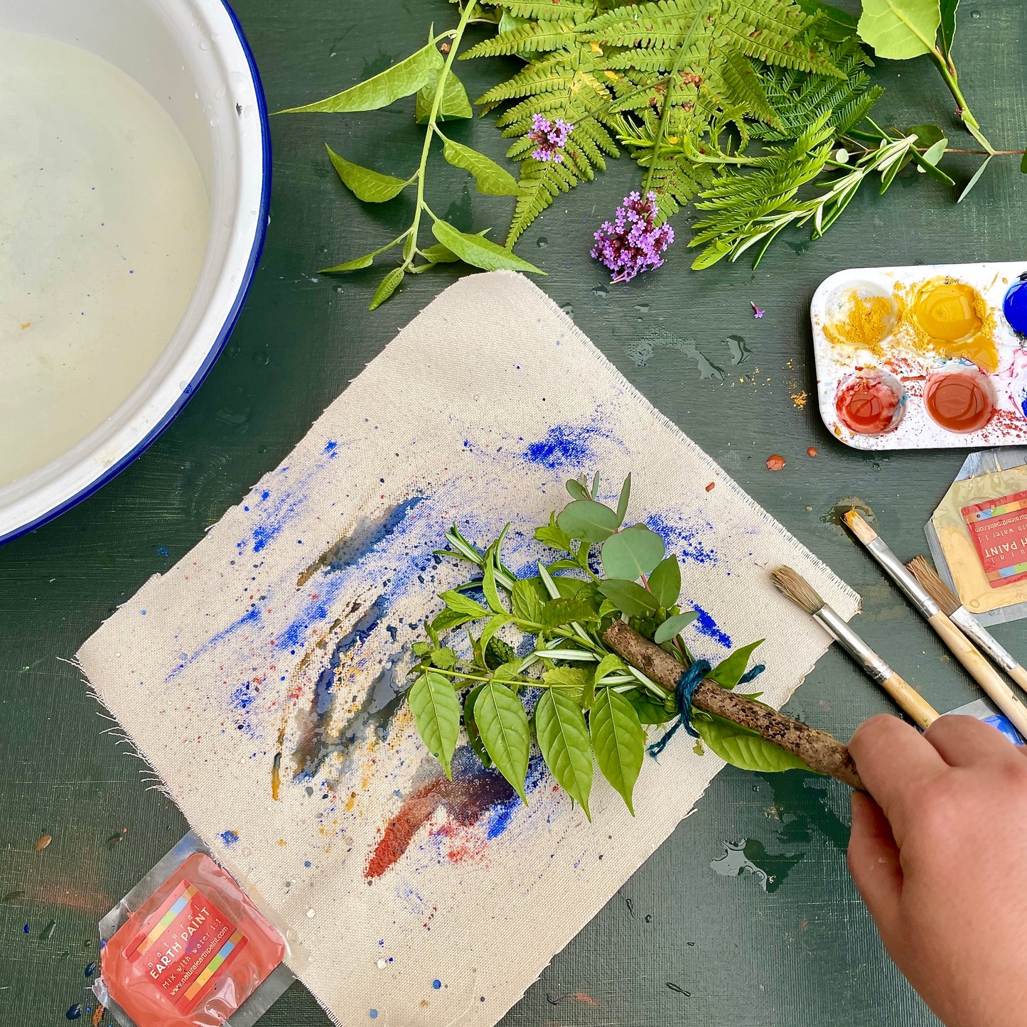 painting with a nature brush on canvas